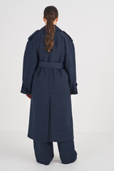 Profile view of model wearing the Oroton Trench Coat in North Sea and 58% Viscose 42% Linen for Women