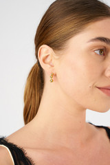 Profile view of model wearing the Oroton Sphere Drop Earrings in 18K Gold and Sustainably sourced 925 Sterling Silver for Women