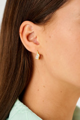 Profile view of model wearing the Oroton Calypso Hoop in 18K Gold and Recycled 925 Sterling Silver for Women