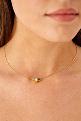 Profile view of model wearing the Oroton Calypso Onyx Necklace in 18K Gold and Recycled 925 Sterling Silver for Women