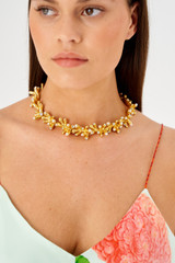 Profile view of model wearing the Oroton Lucia Necklace in Worn Gold and Brass for Women