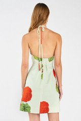 Profile view of model wearing the Oroton Posie Geranium Bell Dress in Sea Spray and 100% linen for Women