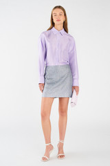 Profile view of model wearing the Oroton Silk Long Sleeve Shirt in Lilac and 100% silk for Women