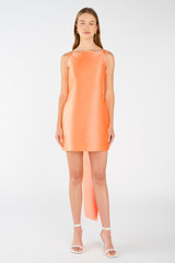 Profile view of model wearing the Oroton Drape Back Mini Dress in Bright Melon and 85% polyester, 15% silk for Women