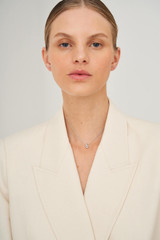 Profile view of model wearing the Oroton Leighton Necklace in Silver and Brass for Women