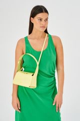 Profile view of model wearing the Oroton Caroline Small Day Bag in Lemon Zest and Smooth leather for Women