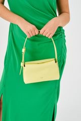 Profile view of model wearing the Oroton Caroline Small Day Bag in Lemon Zest and Smooth leather for Women