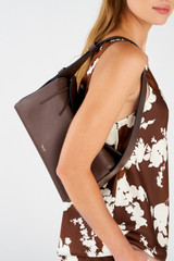 Profile view of model wearing the Oroton Caroline Hobo in Bear Brown and Smooth leather for Women