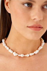 Profile view of model wearing the Oroton Marleigh Necklace in Gold and Baroque & irregular freshwater pearl for Women