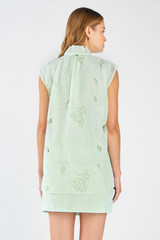 Profile view of model wearing the Oroton Tie Neck Lace Top in Sea Spray and 100% polyester for Women