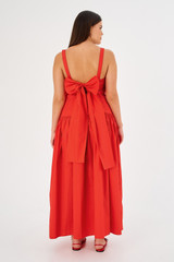 Profile view of model wearing the Oroton Tie Back Sundress in Poppy and 100% cotton for Women