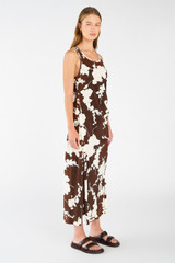 Profile view of model wearing the Oroton Silhouette Print Slip Dress in Deep Spice and 100% silk for Women
