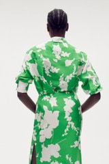 Profile view of model wearing the Oroton Silhouette Print Long Sleeve Shirt in Jewel Green and 100% silk for Women