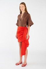 Profile view of model wearing the Oroton Poplin Short Sarong Skirt in Poppy and 100% cotton for Women