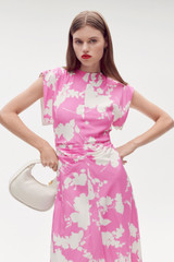 Profile view of model wearing the Oroton Silhouette Print Silk Dress in Carmine Pink and 92% silk, 8% spandex for Women