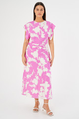 Profile view of model wearing the Oroton Silhouette Print Silk Dress in Carmine Pink and 92% silk, 8% spandex for Women