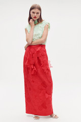 Profile view of model wearing the Oroton Long Lace Skirt in Poppy and 100% polyester for Women