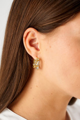 Profile view of model wearing the Oroton Calypso Cluster Double Hoops in 18K Gold and Recycled Sterling Silver for Women