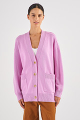 Profile view of model wearing the Oroton Merino Long Line Cardi in Lilac and 100% Merino Wool for Women