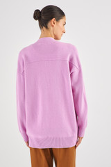 Profile view of model wearing the Oroton Merino Long Line Cardi in Lilac and 100% Merino Wool for Women