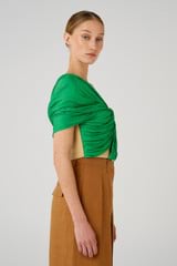 Profile view of model wearing the Oroton Blocked Drape Bodice in Jewel Green and 77% cotton, 23% linen & 100% recycled polyester for Women