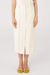 Profile view of model wearing the Oroton Trouser Skirt in Cream and 100% cotton for Women