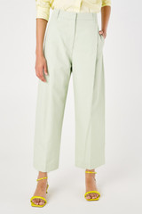 Profile view of model wearing the Oroton Twill Pleat Pant in Eau De Nil and 77% cotton 23% linen for Women