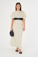 Profile view of model wearing the Oroton Spot Print Dress in Vanilla Bean and 100% Silk for Women