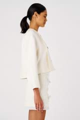 Profile view of model wearing the Oroton Crop Jacket in Cream and 58% Viscose, 42% Linen for Women