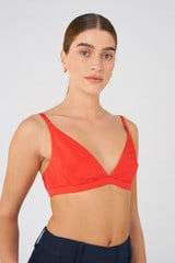 Profile view of model wearing the Oroton Silk Bralette in Poppy and 92% silk, 8% Spandex for Women