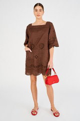 Profile view of model wearing the Oroton Broderie Tunic Dress in Espresso and 100% linen for Women