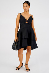 Profile view of model wearing the Oroton Tiered Bodice Dress in Black and 100% Linen for Women