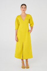 Profile view of model wearing the Oroton Bodice Dress in Vivid Yellow and 58% Viscose, 42% Linen for Women