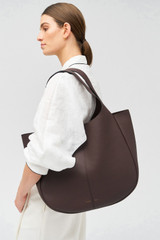 Profile view of model wearing the Oroton Emilia Large Tote in Bear Brown and Pebble leather for Women