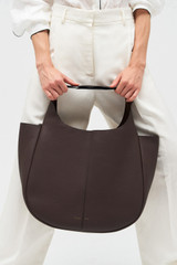 Profile view of model wearing the Oroton Emilia Large Tote in Bear Brown and Pebble leather for Women