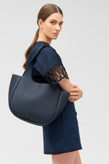 Profile view of model wearing the Oroton Emilia Tote in North Sea and Pebble leather for Women