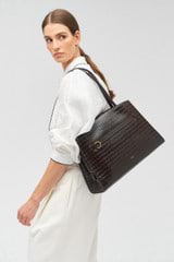 Profile view of model wearing the Oroton Audrey Texture Three Pocket Day Bag in Mahogany and Textured leather for Women