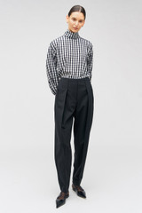 Profile view of model wearing the Oroton Waiter's Pant in Black and 53% polyester, 42% wool, 5% elastane for Women