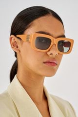 Profile view of model wearing the Oroton Alice Sunglasses in Clay and Acetate for Women