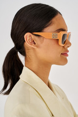 Profile view of model wearing the Oroton Alice Sunglasses in Clay and Acetate for Women