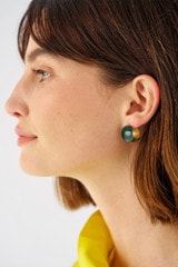 Profile view of model wearing the Oroton Josie Huggies in Treehouse Green and Eco brass base metal for Women