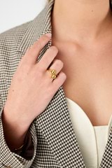 Profile view of model wearing the Oroton Sphere Ring in 18K Gold and Sustainably sourced 925 Sterling Silver for Women