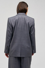 Profile view of model wearing the Oroton Man Style Blazer in Dark Ash and 50% wool, 50% recycled polyester for Women