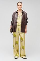Profile view of model wearing the Oroton Linear Tulip Pj Pant in Fennel and 100% silk for Women
