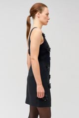 Profile view of model wearing the Oroton Flower Sequin Shift Dress in Black and 100% linen for Women