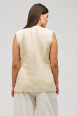 Profile view of model wearing the Oroton Flower Sequin Tunic in Limestone and 100% linen for Women