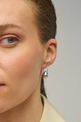Profile view of model wearing the Oroton Bonnie Tear Drop Bead Earrings in Silver and Sustainably sourced 925 Sterling Silver for Women