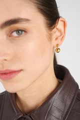 Profile view of model wearing the Oroton Bonnie Bead Drop Earrings in 18K Gold and Sustainably sourced 925 Sterling Silver for Women