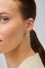 Profile view of model wearing the Oroton Bonnie Bead Drop Earrings in Silver and Sustainably sourced 925 Sterling Silver for Women