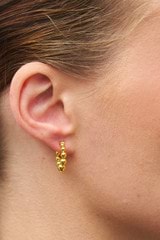 Profile view of model wearing the Oroton Bonnie Bead Hoops in Gold and 100% Recycled Sterling Silver for Women